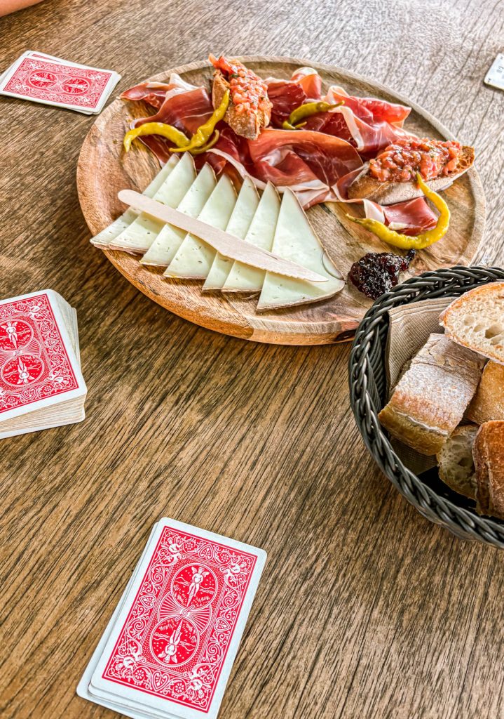 Chacuterie and a card game at Extola Bibi in Biarritz