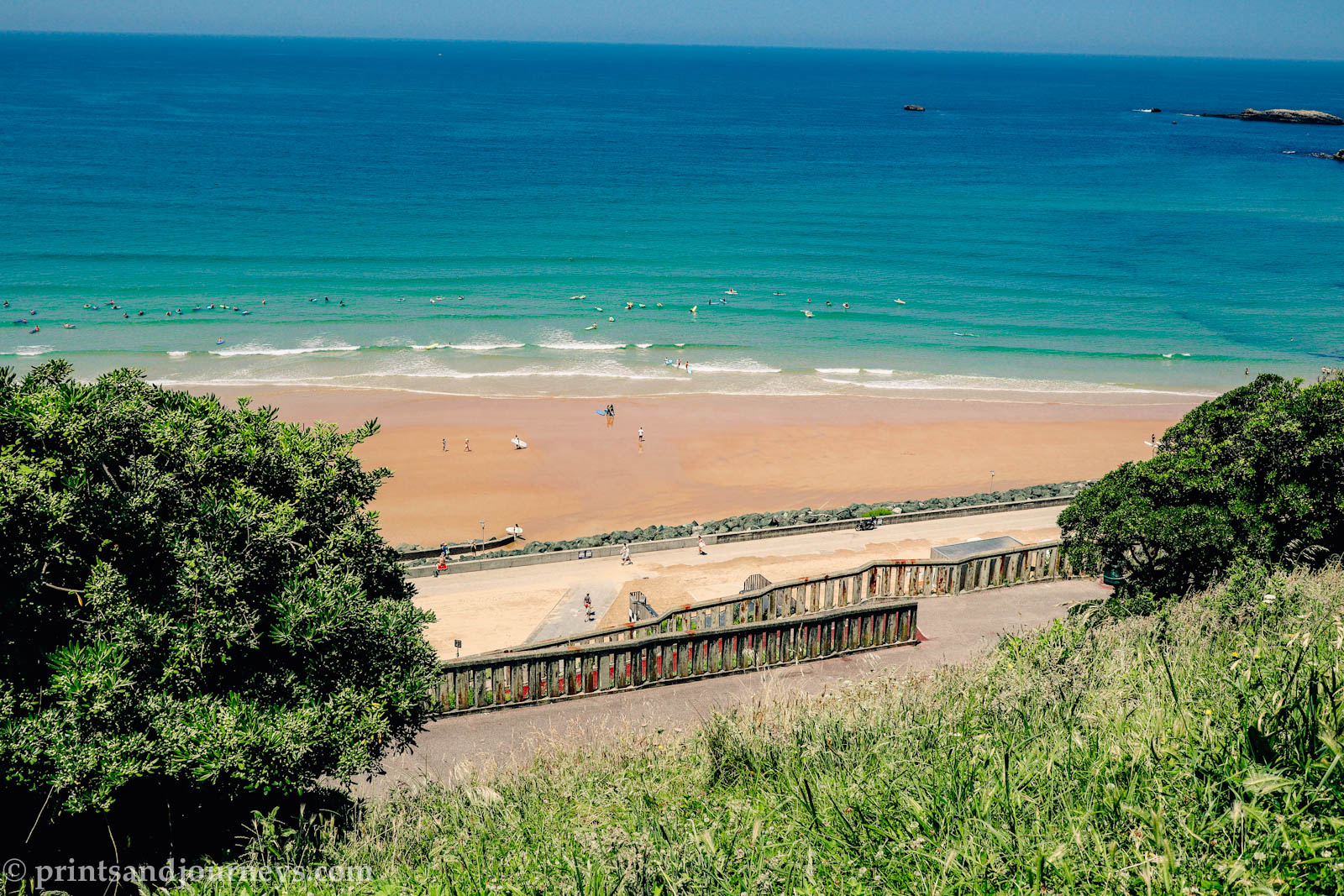 cote des basques beach from above with surfers and beachgoers
