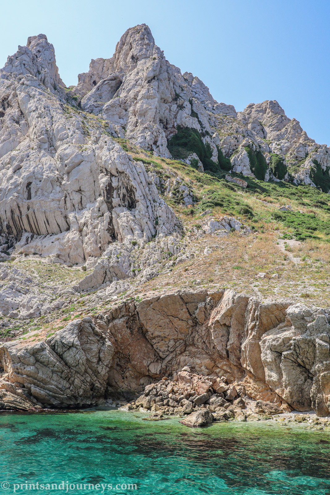 Turquoise blue water and white limestone cliffs in Calanques National Park near Marseille, France