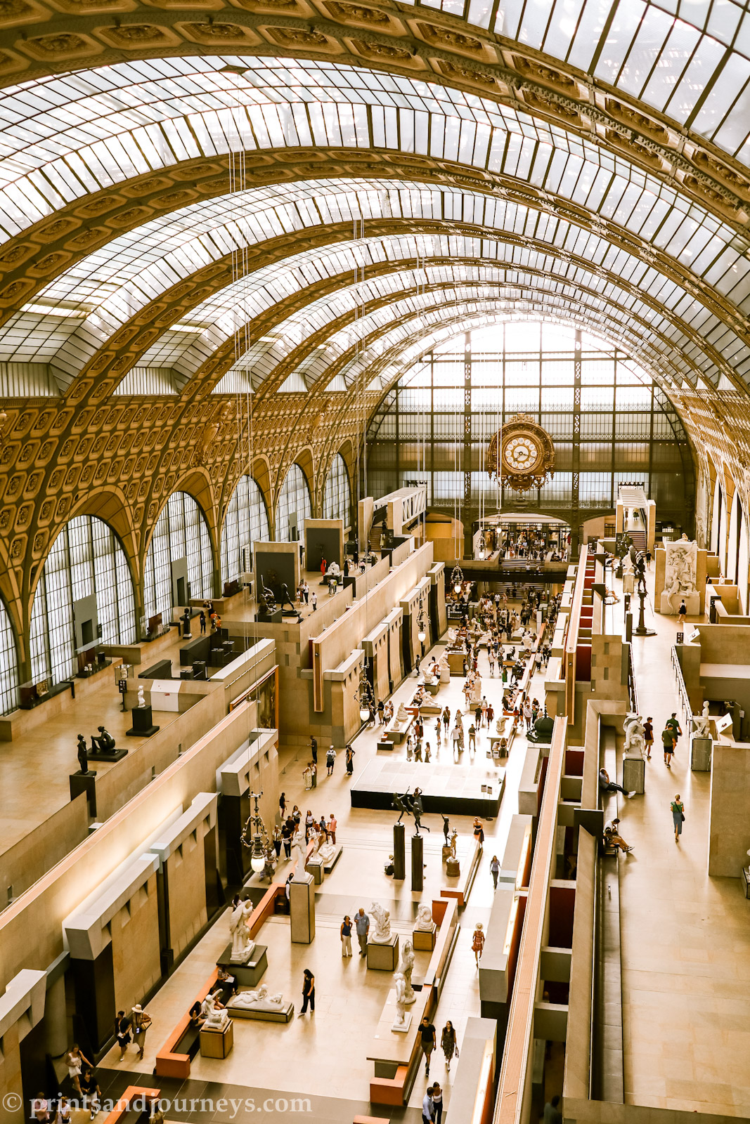 a photo of the train station ceiling and hall inside the musee d'orsay