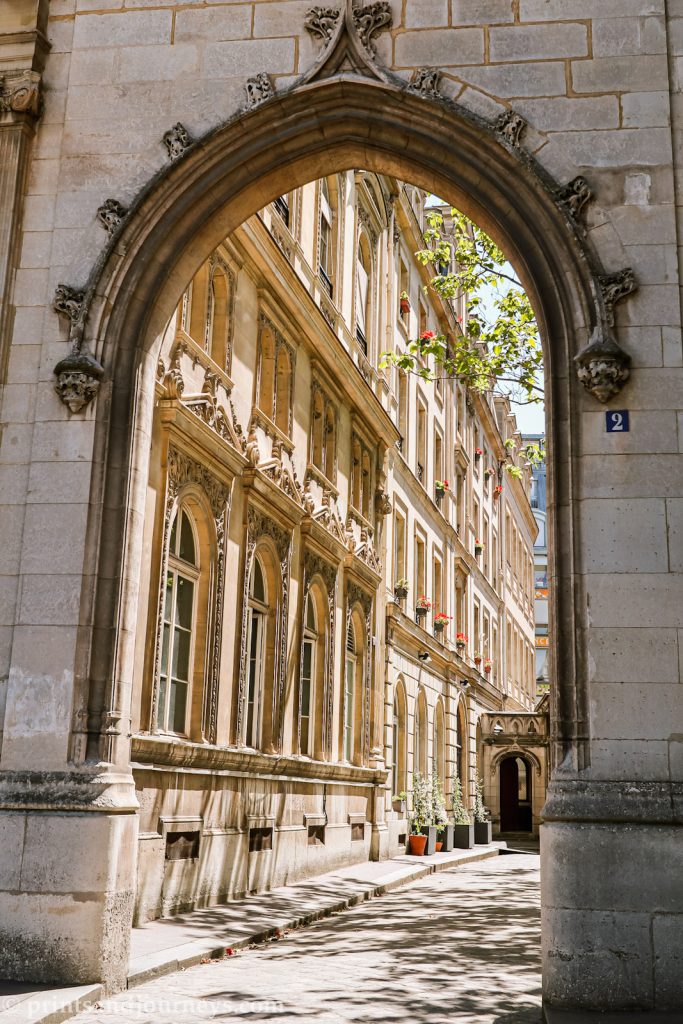 a scenic sunny archway along the parisian streets
