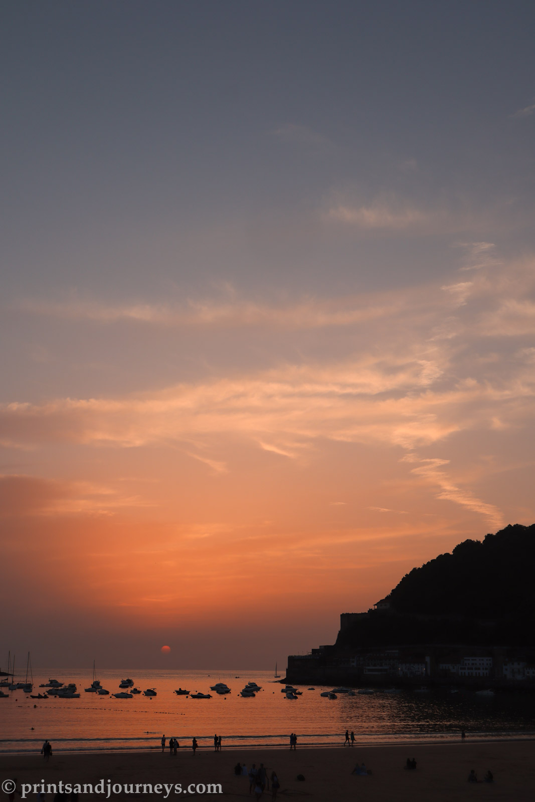 pink sunset over la concha beach in san sebastian